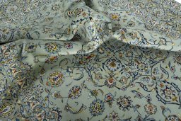 Surface texture of 1970s Kashan rug with natural Wool and intricate pattern