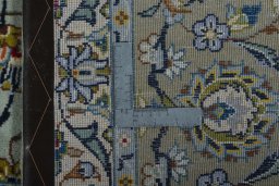 Backside of handmade 1970s Kashan rug showing knot structure and weave density