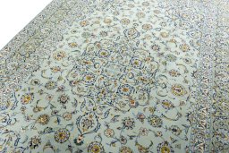 Backside of handmade 1970s Kashan rug showing knot structure and weave density
