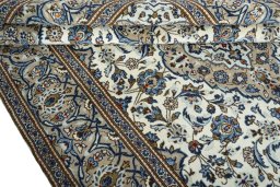 Close-up detail of 2000s Kashan rug from Iran / Persia showing Wool weave