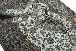 Surface texture of 2000s Kashan rug with natural Wool and intricate pattern