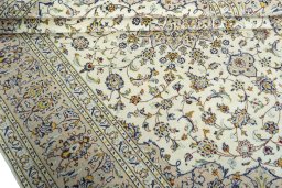Close-up detail of 2000s Kashan rug from Iran / Persia showing Wool weave