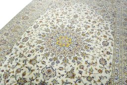 Backside of handmade 2000s Kashan rug showing knot structure and weave density