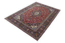 Corner detail of 2000s Kashan rug showing border pattern and Wool pile