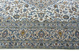 Corner detail of 2000s Kashan rug showing border pattern and Wool pile