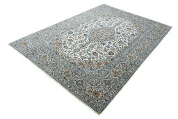 Corner detail of 2000s Kashan rug showing border pattern and Wool pile