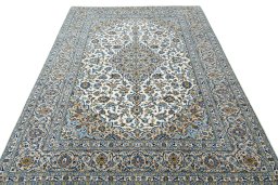 Surface texture of 2000s Kashan rug with natural Wool and intricate pattern