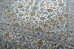Close-up detail of 2000s Kashan rug from Iran / Persia showing Wool weave