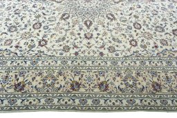 Corner detail of 2000s Kashan rug showing border pattern and Wool pile