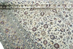 Close-up detail of 2000s Kashan rug from Iran / Persia showing Wool weave