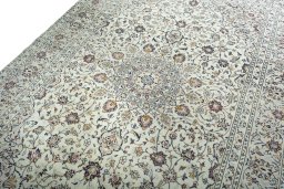 Backside of handmade 2000s Kashan rug showing knot structure and weave density