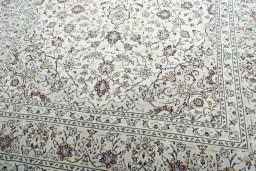 Close-up detail of 2000s Kashan rug from Iran / Persia showing Wool weave