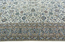 Corner detail of 2000s Kashan rug showing border pattern and Wool pile