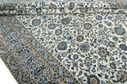 Close-up detail of 2000s Kashan rug from Iran / Persia showing Wool weave