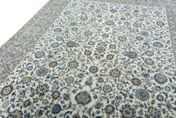 Backside of handmade 2000s Kashan rug showing knot structure and weave density
