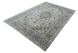 Corner detail of 2000s Kashan rug showing border pattern and Wool pile