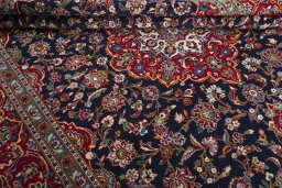 Close-up detail of 2000s Kashan rug from Iran / Persia showing Wool weave