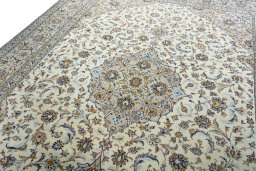 Backside of handmade 2000s Kashan rug showing knot structure and weave density
