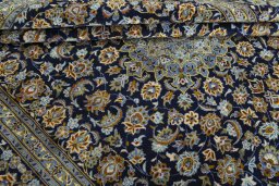 Close-up detail of 2000s Kashan rug from Iran / Persia showing Wool weave