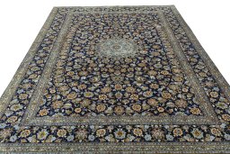 Surface texture of 2000s Kashan rug with natural Wool and intricate pattern