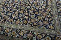 Close-up detail of 2000s Kashan rug from Iran / Persia showing Wool weave