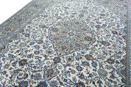 Backside of handmade 2000s Kashan rug showing knot structure and weave density