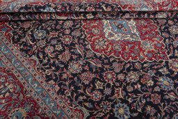 Close-up detail of 2000s Kashan rug from Iran / Persia showing Wool weave