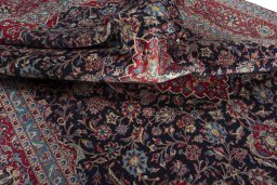 Surface texture of 2000s Kashan rug with natural Wool and intricate pattern
