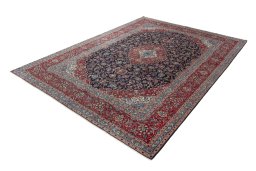 Corner detail of 2000s Kashan rug showing border pattern and Wool pile