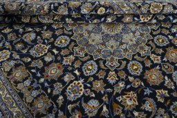 Close-up detail of 2000s Kashan rug from Iran / Persia showing Wool weave