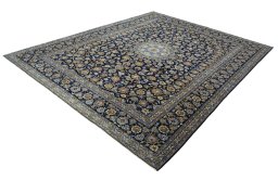 Corner detail of 2000s Kashan rug showing border pattern and Wool pile