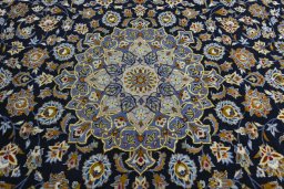 Central medallion detail of 2000s Kashan rug from Iran / Persia