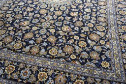 Close-up detail of 2000s Kashan rug from Iran / Persia showing Wool weave