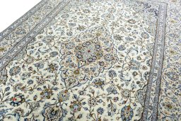 Backside of handmade 2000s Kashan rug showing knot structure and weave density