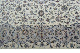Corner detail of New Kashan rug showing border pattern and Cork pile