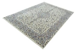 Corner detail of New Kashan rug showing border pattern and Cork pile