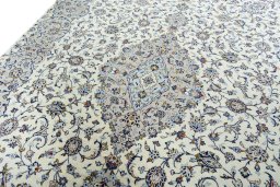 Backside of handmade New Kashan rug showing knot structure and weave density