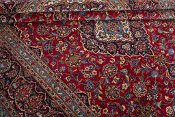 Close-up detail of 2000s Kashan rug from Iran / Persia showing Wool weave
