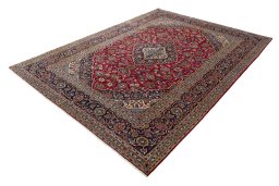 Corner detail of 2000s Kashan rug showing border pattern and Wool pile