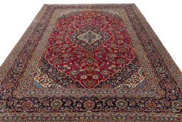 Surface texture of 2000s Kashan rug with natural Wool and intricate pattern