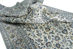 Surface texture of 2000s Kashan rug with natural Wool and intricate pattern