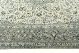 Corner detail of 2000s Kashan rug showing border pattern and Wool pile