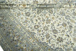 Close-up detail of 2000s Kashan rug from Iran / Persia showing Wool weave