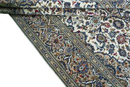 Close-up detail of 2000s Kashan rug from Iran / Persia showing Wool weave