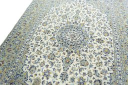 Backside of handmade 2000s Kashan rug showing knot structure and weave density