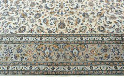 Corner detail of 2000s Kashan rug showing border pattern and Wool pile