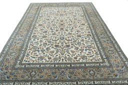 Surface texture of 2000s Kashan rug with natural Wool and intricate pattern