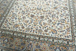 Close-up detail of 2000s Kashan rug from Iran / Persia showing Wool weave