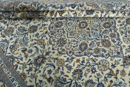 Close-up detail of 2000s Kashan rug from Iran / Persia showing Wool weave