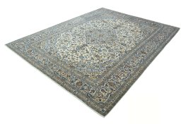 Corner detail of 2000s Kashan rug showing border pattern and Wool pile